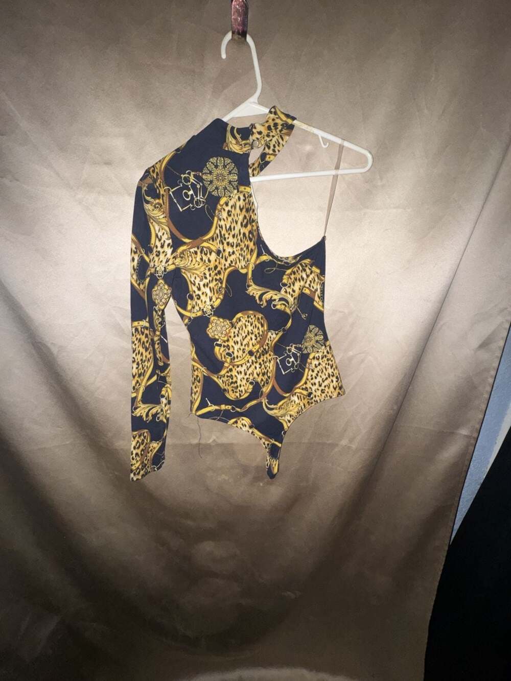 Nylon Apparel Leopard and Gold Chain Print One-Shoulder Long Sleeve Bodysuit
